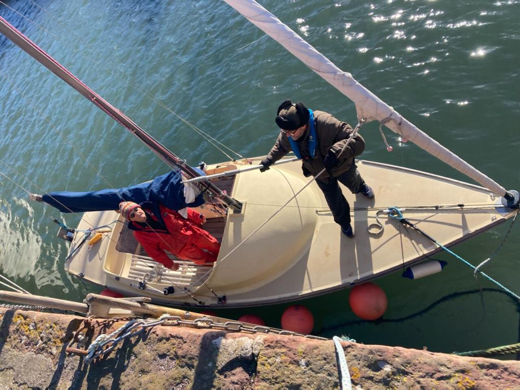 The author's father and his neighbour Ross Dalgleish on a wooden sailboat